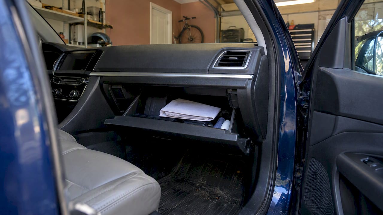 Auto policy inside an open glove compartment